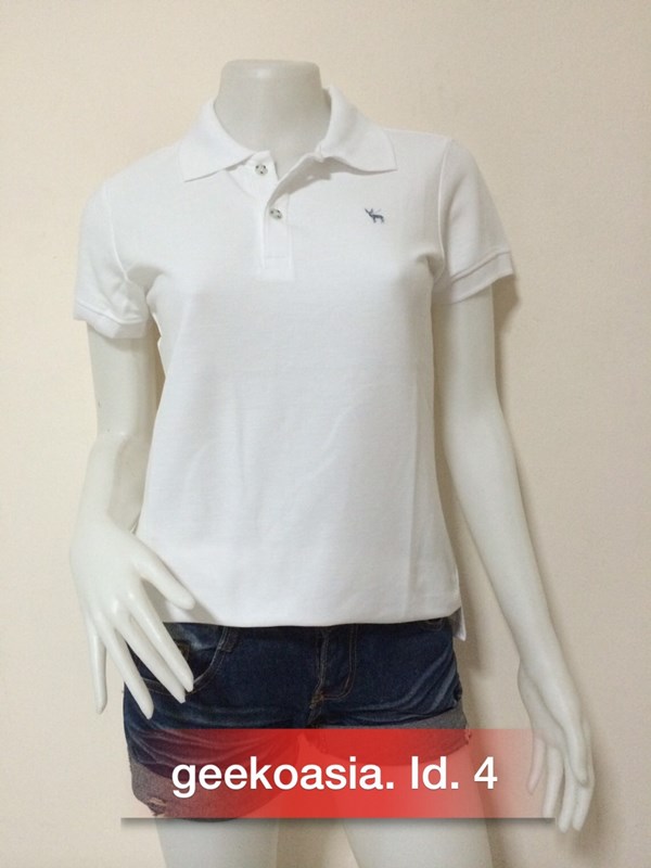 เสื้อโปโลสีพื้นหญิง ขาว