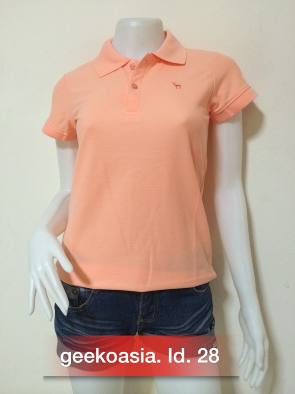 เสื้อโปโลสีพื้นหญิง โอสรอมส้ม